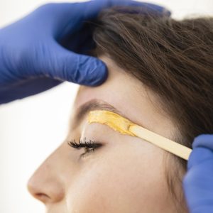 woman-getting-eyebrow-treatment